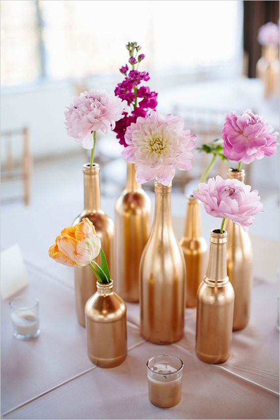 spray-painted glass bottles look gorgeous as simple vases for individual blossoms