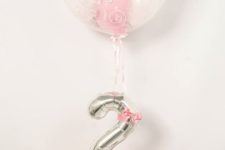 17 pink balloons with a silver number and a large balloon with balloons inside