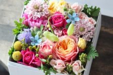 18 a box filled with various blooms is a cute and easy idea