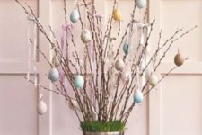 20 pastel egg ornaments on willow branches as a beautiful Easter display