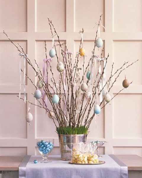 pastel egg ornaments on willow branches as a beautiful Easter display