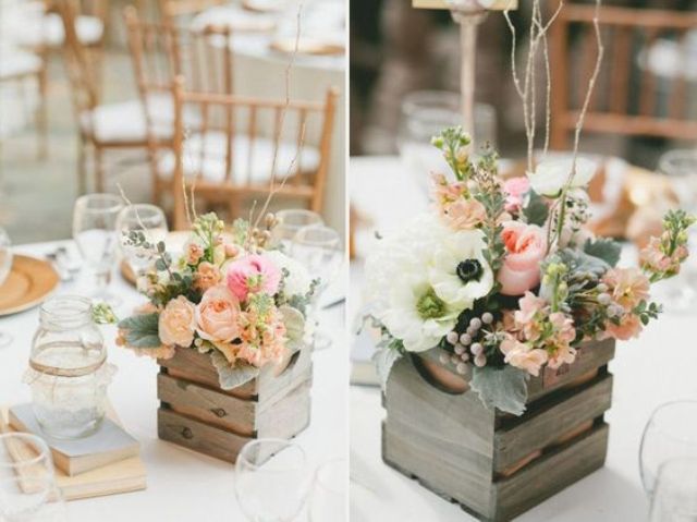put vases into rustic pallet boxes for a sweet touch