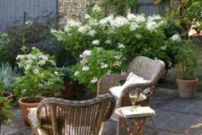 wicker furniture is true country style, and flood your outdoors with flowers