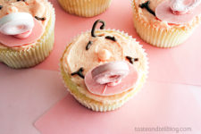 DIY pink vanilla cupcakes with baby faces and pacifiers