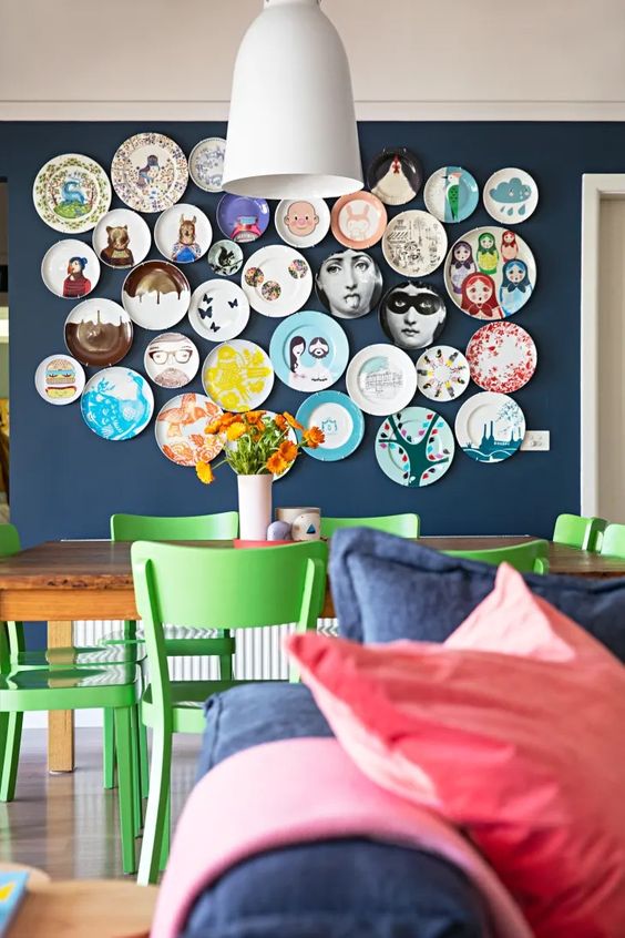 a colorful and fun plate wall is a gorgeous decoration for any modern dining space or some other room