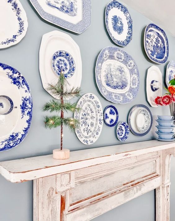 a faux mantel with a chinoiserie plate wall is a lovely combo for a rustic, vintage or eclectic space