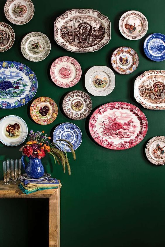 a large plate wall of beautiful vintage plates that bring interest to the space and make it cooler