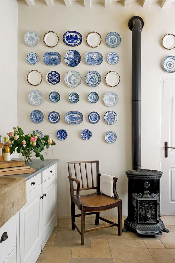 a refined vintage chinoiserie plate wall is a stylish solution for a vintage kitchen or dining room