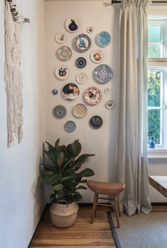 an eclectic plate wall is a gorgeous solution for an eclectic or a boho dining room like this one