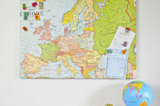 DIY upcycled magnetic board covered with a map