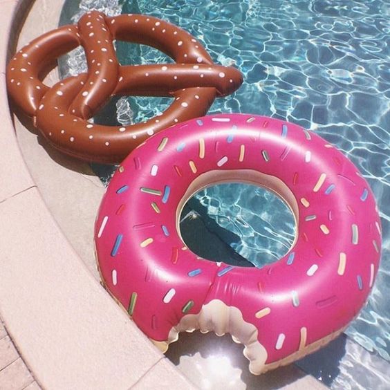 a bitten donut and a bagel float fo a fun party