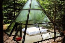 03 a metal and glass pyramid with a bed inside to enjoy the views around and merge with nature