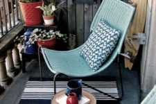 03 aqua-colored wicker chairs and a tiny round coffee table