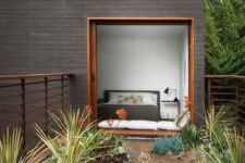04 a modern small house in your garden covered with dark wood