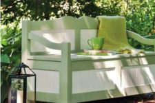 04 outdoor rustic styled bench in green and white and with storage space inside