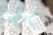 05 candy favors in baby’s bottles with turquoise ribbons