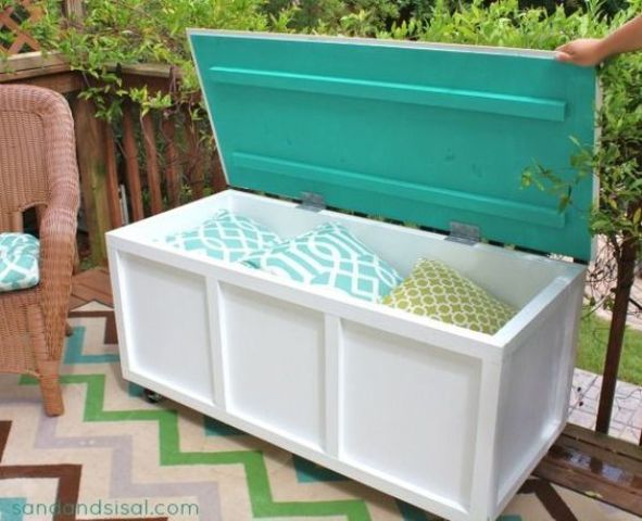 cute patio bench with space for storing pillows inside