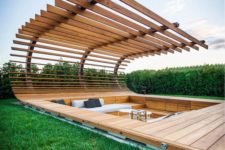 06 stunning sunken conversation pit in the wooden deck and with a slab roof over it
