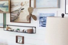 07 coastal-inspired wall with artworks and items connected with the sea