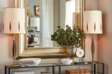 09 oversized rectangle mirror in a gilded frame makes a statement