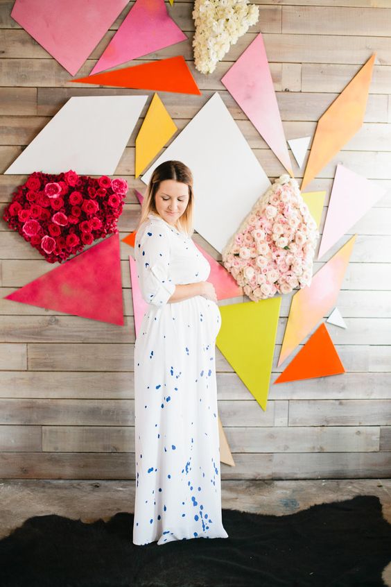 unique geometric backdrop in bold colors and with floral decor
