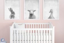 11 a set of three animal prints in black and white contrasts with the pink walls