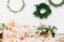 11 various greenery wreaths hanging over the table for cute decor