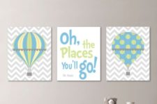 12 a trio of signs with hot air balloons and a quote