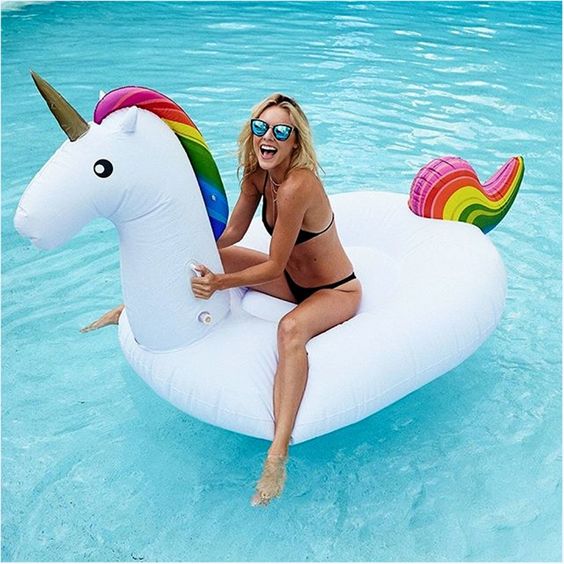 funny unicorn pool float with a horn and colorful details