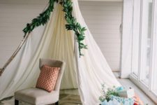 13 a teepee topped with greenery for a boho shower