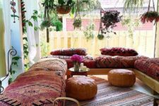 14 outdoor lounge with bold upholstery furniture and rugs and traditional ottomans and lanterns