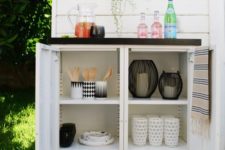 15 an outdoor buffet made of two Ikea metal cabinets and a custom tiled top