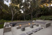 17 minimalist stone outdoor conversation pit with benches and a long narrow fireplace