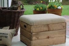 18 upholstered crate stool with storage space inside it