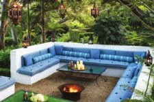 18 white concrete conversation pit with a fire bowl and tables