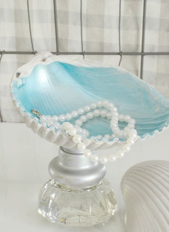 create your own mermaid inspired jewelry bowls with some treasures of old knobs and shells