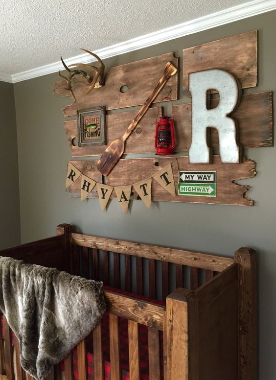reclaimed wood decor with an oar, a lantern and antlers