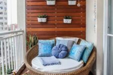 21 wicker love seat perfectly matches this balcony size