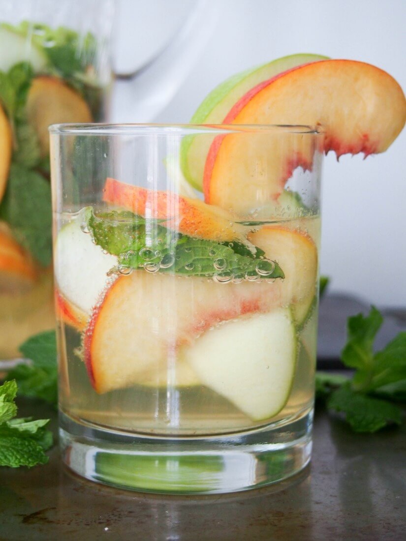 DIY white sangria with whiskey, apple and peach