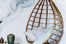 03 a rattan hanging chair can make a bold statement in any modern space