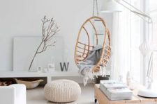 04 a rattan hanging chair on a chain makes the interior warmer