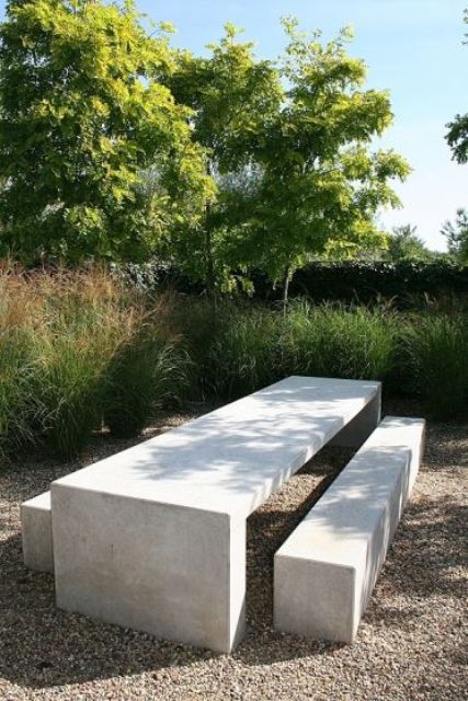 a concrete dining set in the garden is very durable and practical