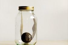 09 a golden snitch in a jar can be DIYed and can become a cute home decoration