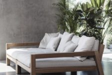 11 a modern wooden loveseat with armrests and comfy upholstery