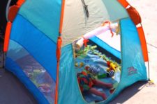 11 colorful blue and orange outdoor tent filled with toys to keep your kid busy