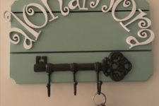 13 a key holder with a large vintage key and Alohamora spell