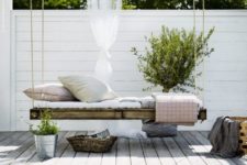 15 a whitewashed Scandinavian backyard with a pallet hanging bed