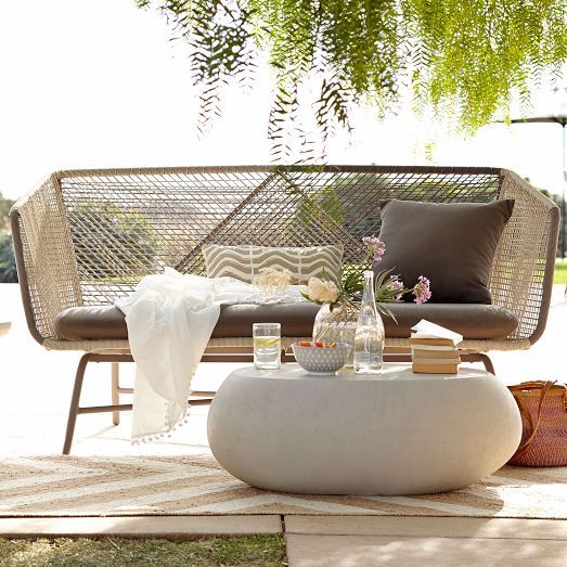 an ethereal wicker seating on metal legs looks very stylish and boho chic