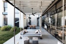 16 an outdoor space with a dining zone, concrete stools and a hanging bed