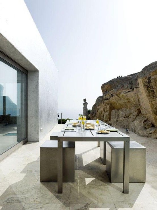 concrete and stainless steel are among the best solutions for outdoor furniture because of low maintenance and durability